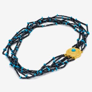 Beaded necklace with gold and turquoise accents.