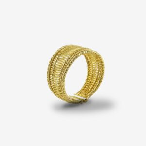 Gold woven bracelet on white background.