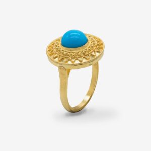 Gold ring with turquoise stone centerpiece.
