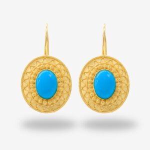 Gold earrings with blue oval stones.