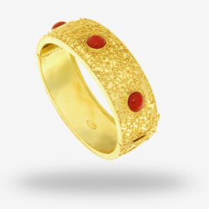 Gold bracelet with red gemstone accents.