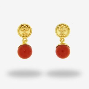 Gold earrings with red stone dangles.