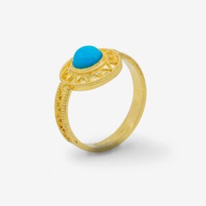 Gold ring with a blue gemstone.